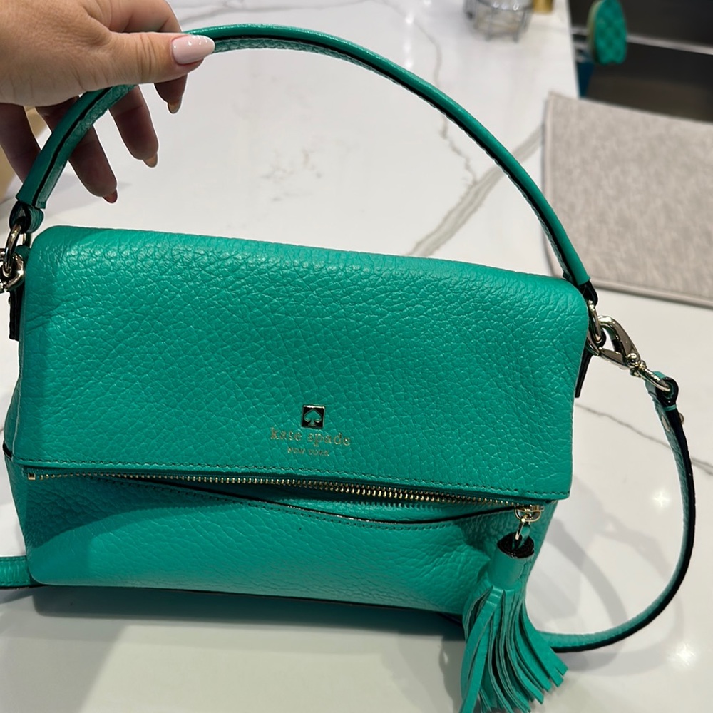 Kate spade teal leather purse which can be worn 2 ways with gold hardware.